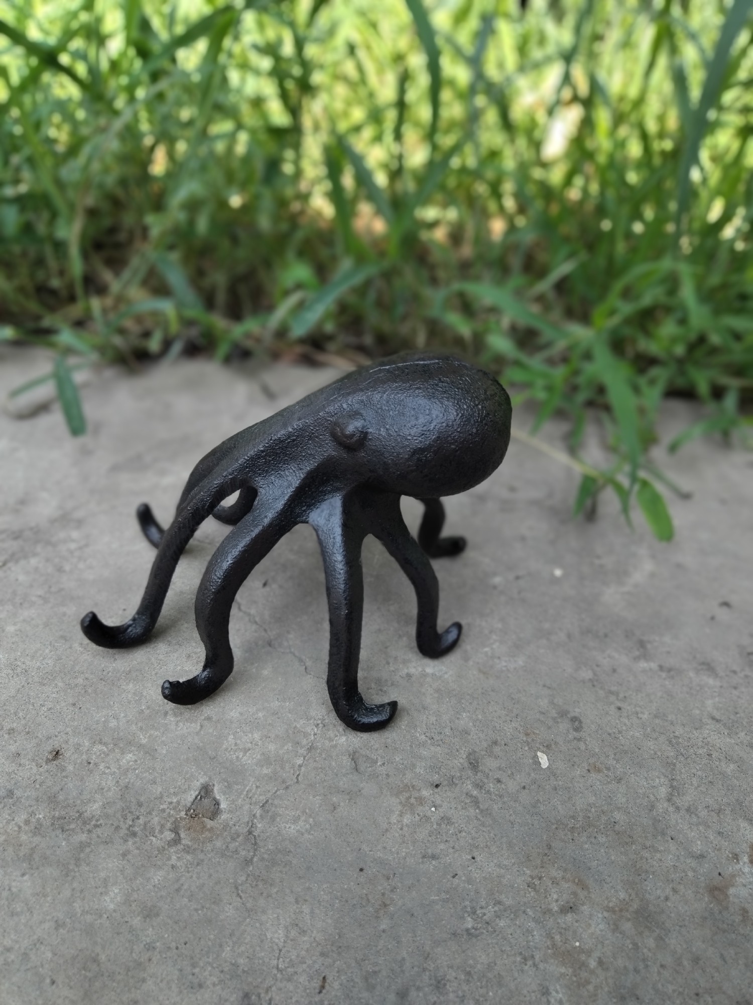 Oktopus aus Gusseisen, B 13 cm, T 16 cm, H 12 cm
